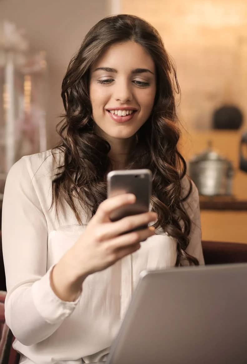 WOman Smiling at Phone Woman Smiling at Phone